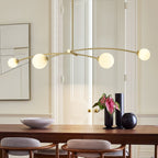 Lampada a sospensione lineare moderna Sputnik a 4 luci color oro/luce per sala da pranzo - 51,18 pollici di larghezza x 11,02 pollici di profondità x 5,91 pollici di altezza