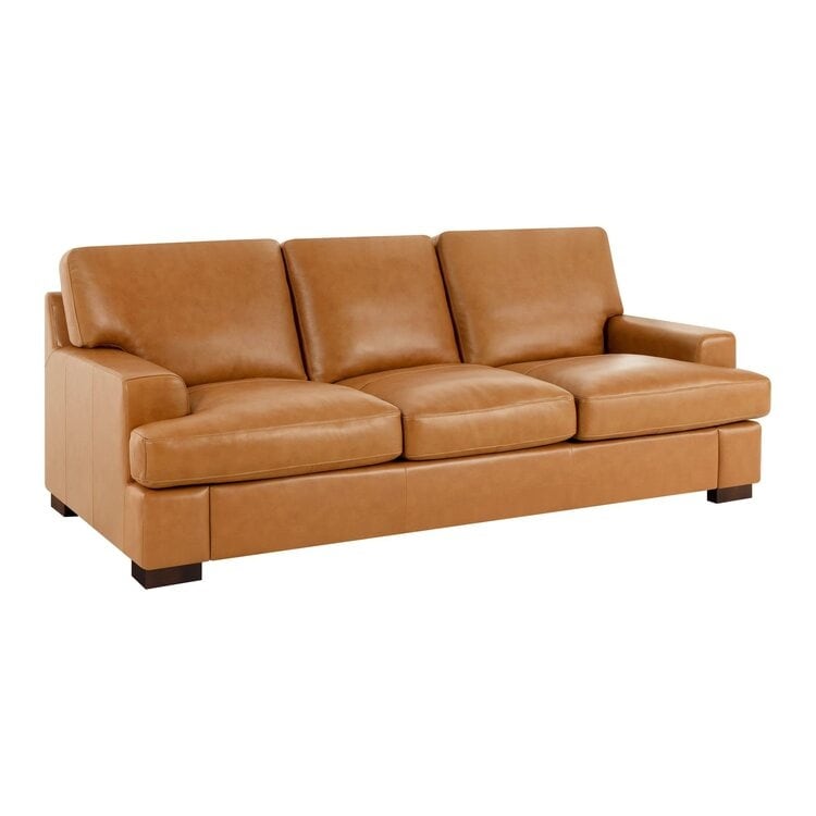 Divano moderno in vera pelle con gambe in legno e cuscino di supporto aggiuntivo