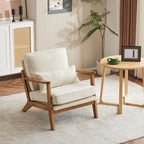 Poltrona imbottita in misto lino con gambe in legno e un cuscino beige