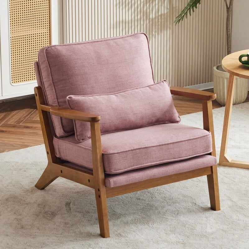 Poltrona imbottita in misto lino con gambe in legno e un cuscino beige