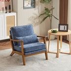 Poltrona imbottita in misto lino con gambe in legno e un cuscino beige