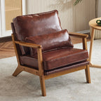 Poltrona imbottita in misto lino con gambe in legno e un cuscino beige